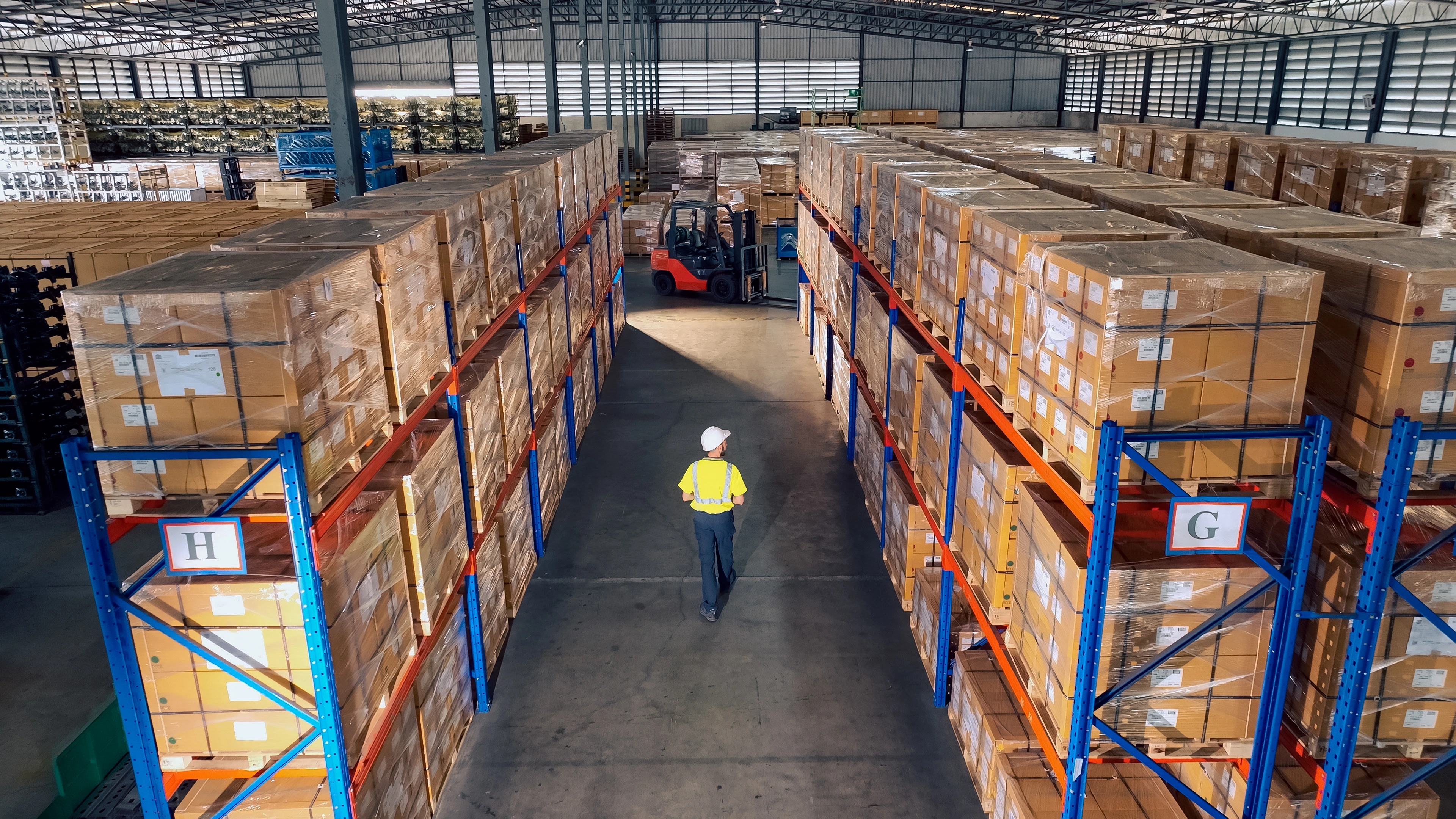 A man in the warehouse with Ariel View